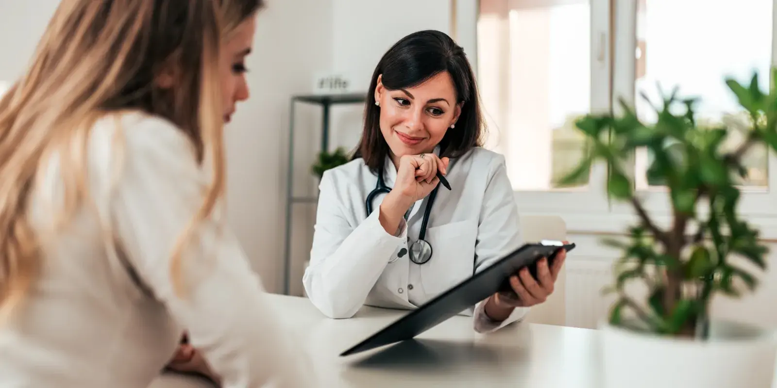 A patient talking privately with a health care professional