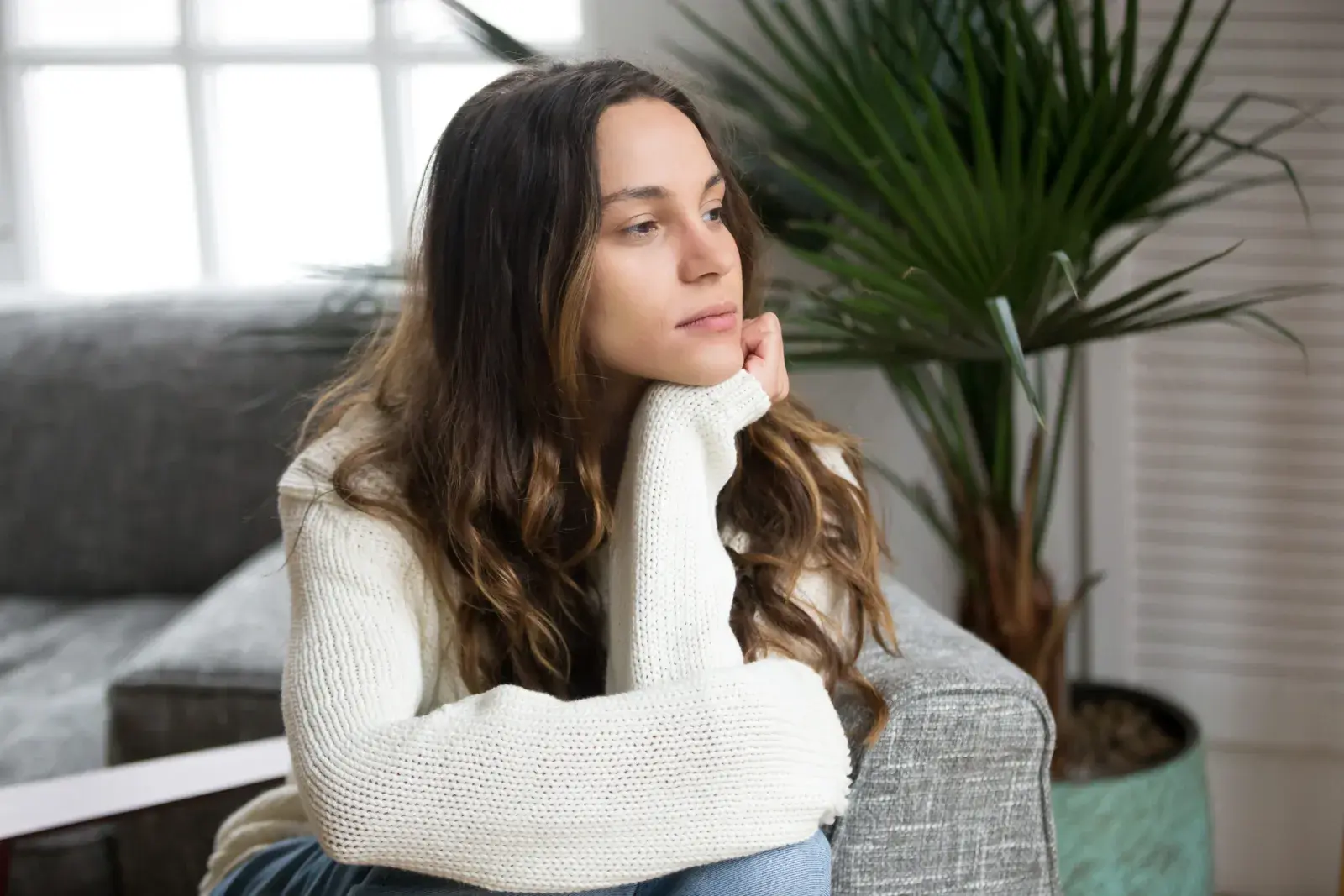 A woman sitting in a quiet, reflective moment
